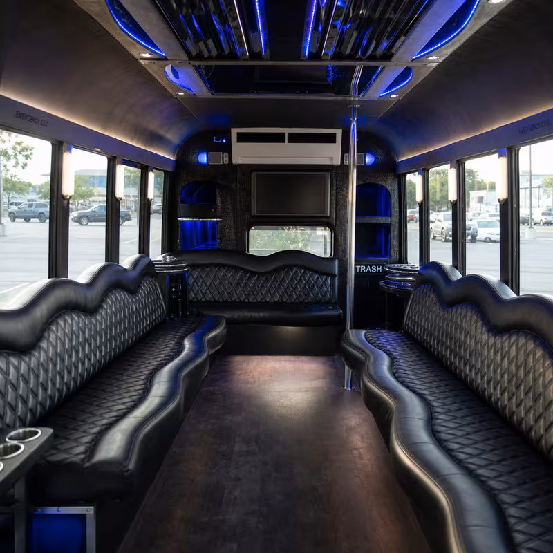 Friends laughing during a Paterson party bus celebration