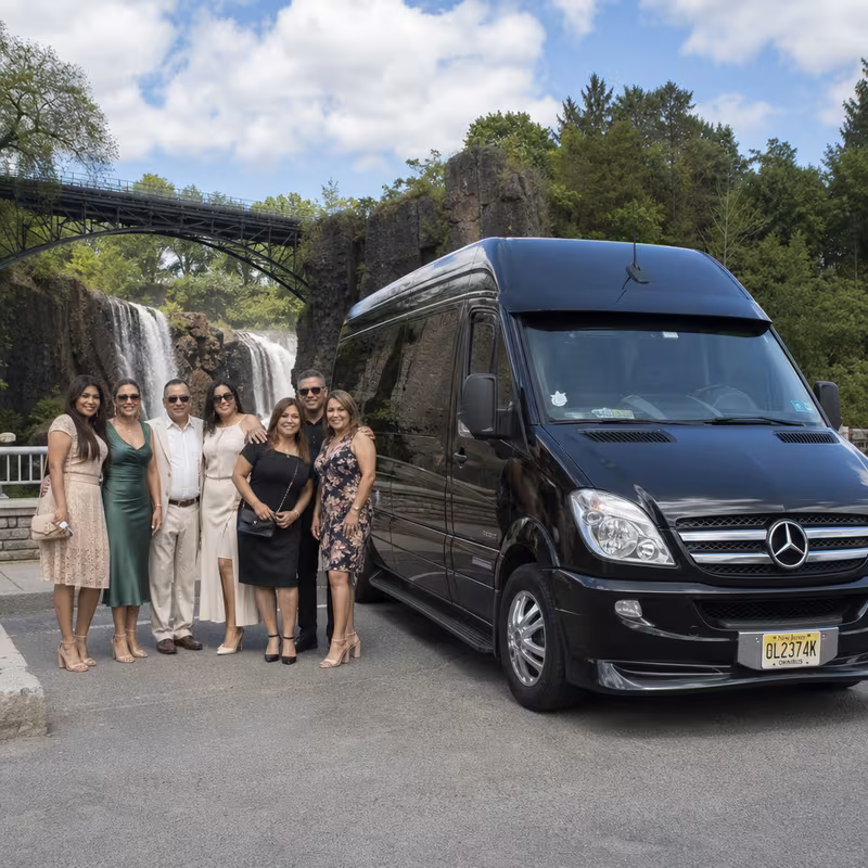 Group beside a Mercedes Sprinter limo from the Paterson fleet