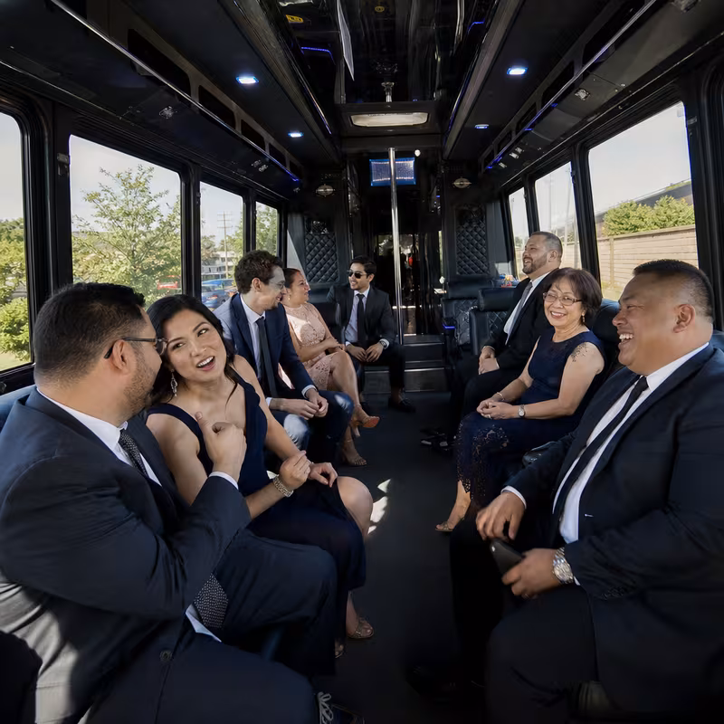 Wedding guests seated inside a Paterson party bus