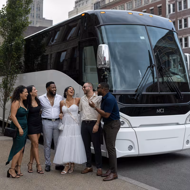 Passengers loading luggage while boarding an Paterson group shuttle
