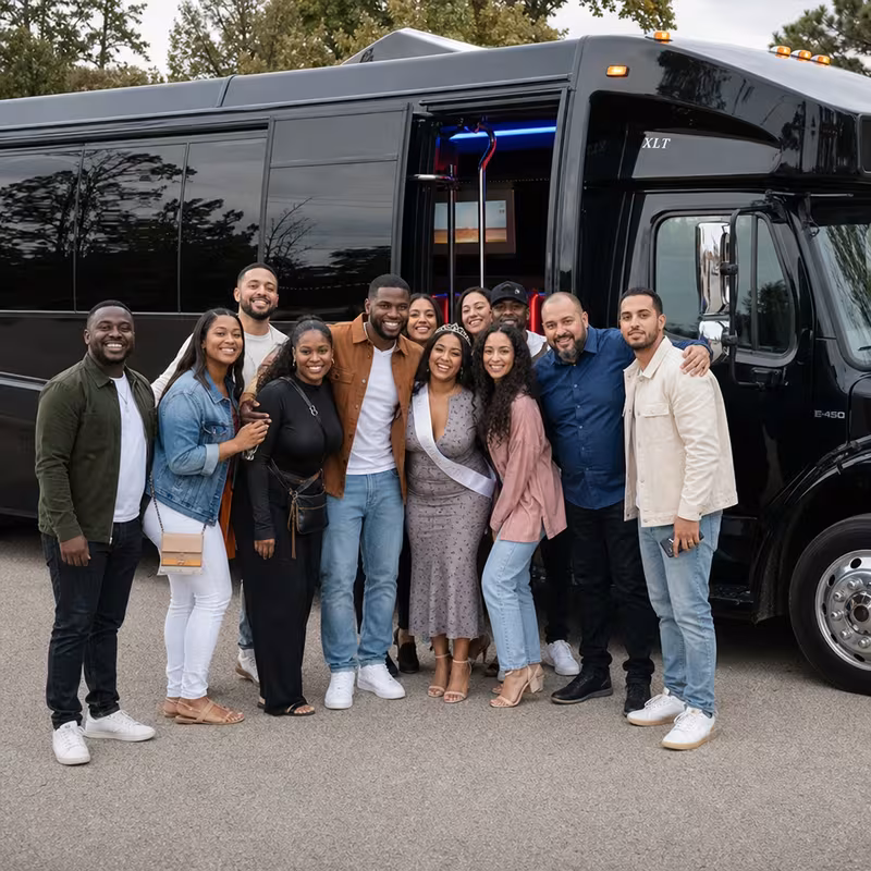 Group boarding a white charter bus for Birthday Transportation transportation in Paterson