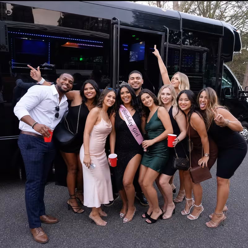 Party bus interior with wraparound leather seating and LED lighting in Paterson