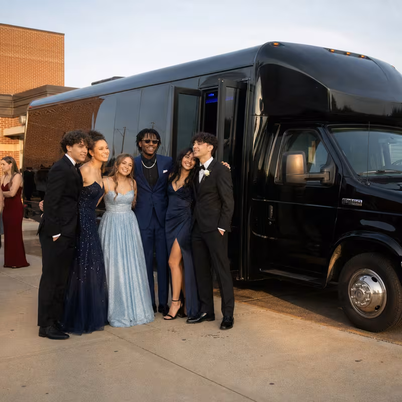 Group boarding a white charter bus for Prom & Homecoming Transportation transportation in Paterson