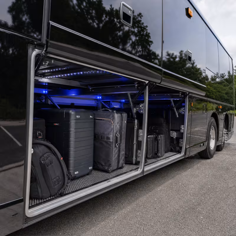 Party bus interior with wraparound leather seating and LED lighting in Paterson