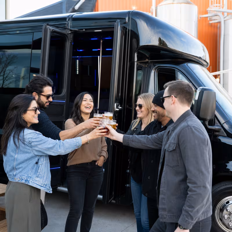 Passengers loading luggage while boarding an Paterson group shuttle